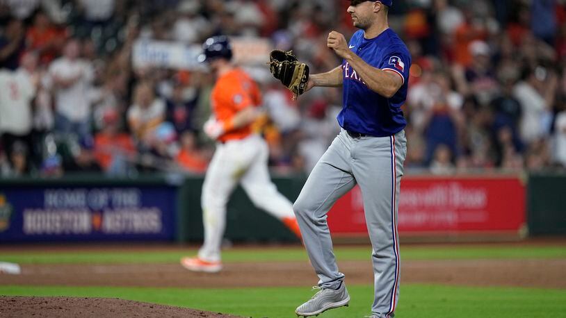 Texas Rangers relief pitcher Brock Burke reacts after giving up a two-run home run to Houston Astros' Kyle Tucker during the seventh inning of a baseball game Friday, April 12, 2024, in Houston. (AP Photo/Kevin M. Cox)
