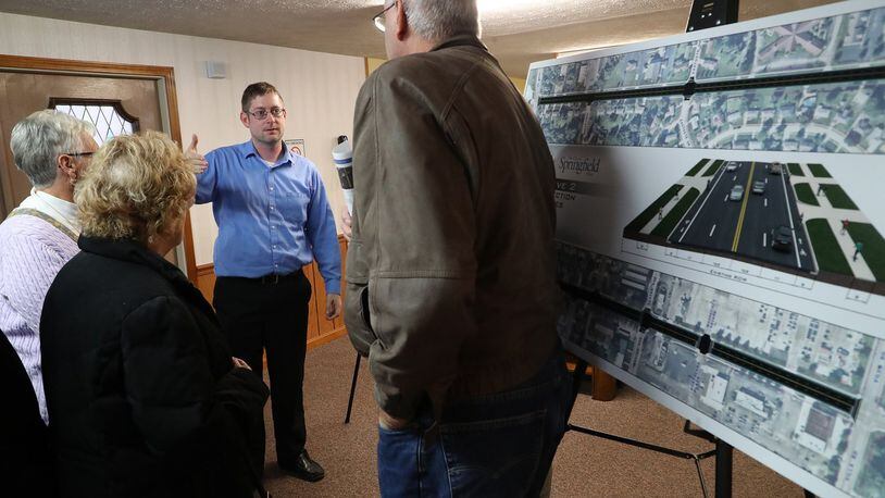 Residents discuss the options for renovating Derr Road Wednesday during a City of Springfield public meeting. BILL LACKEY/STAFF