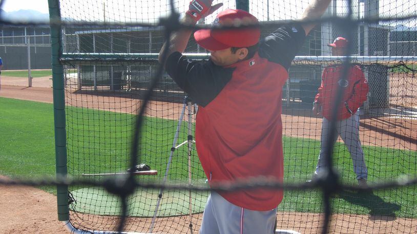 Joey Votto gets some swings during batting practice in Goodyear, Arizona.
