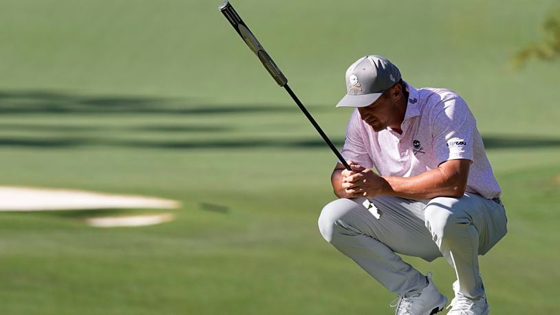 Bryson DeChambeau lines up a putt on the 10th hole during third round at the Masters golf tournament at Augusta National Golf Club Saturday, April 13, 2024, in Augusta, Ga. (AP Photo/George Walker IV)