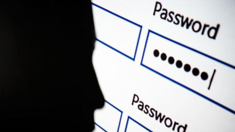 LONDON, ENGLAND - AUGUST 09:   In this photo illustration, A woman is silhouetted against a projection of a password log-in dialog box on August 09, 2017 in London, England. With so many areas of modern life requiring identity verification, online security remains a constant concern, especially following the recent spate of global hacks.  (Photo by Leon Neal/Getty Images)