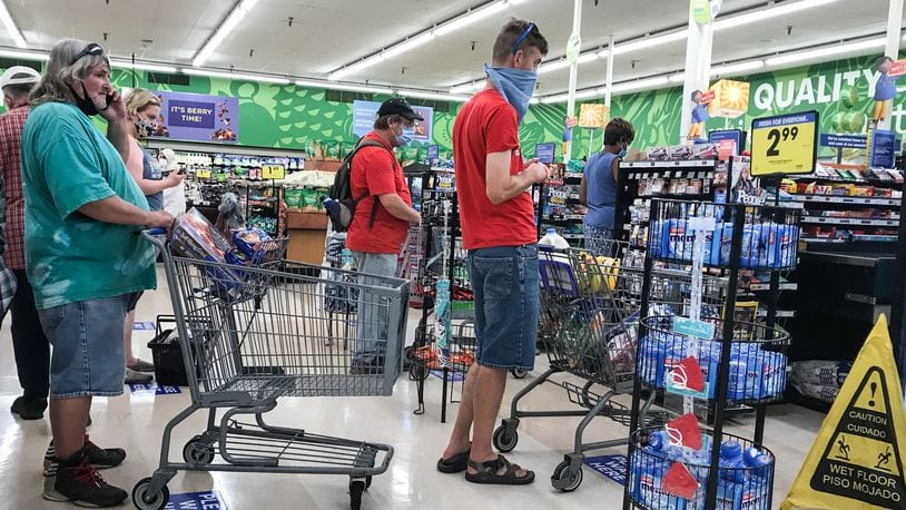 People wait in line at the Krogers on Wayne Ave. Thursday July 9, 2020. The U.S. Census Bureau looked at how Americans spent their stimulus checks. JIM NOELKER/STAFF