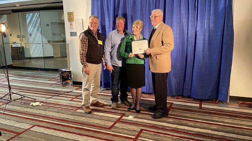 Clark County resident Ed Kranz was recognized at the 94th Ohio Fair Managers Association annual convention for his outstanding service to the fair. From left to right: Dean Blair, Executive Director of the Clark County Fairgrounds; Brian Harbage, President of the Clark County Agricultural Society; Dorothy Pelanda, Director of the Ohio Department of Agriculture; and Ed Kranz. CONTRIBUTED