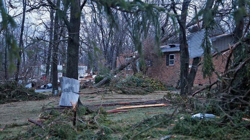 A damaged house and trees along Ridge Road Wednesay, Feb. 28, 2024. BILL LACKEY/STAFF