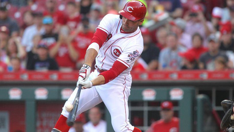 The Reds’ Joey Votto connects with a ball during a game against the Brewers on Tuesday, June 27, 2017, at Great American Ball Park in Cincinnati. David Jablonski/Staff