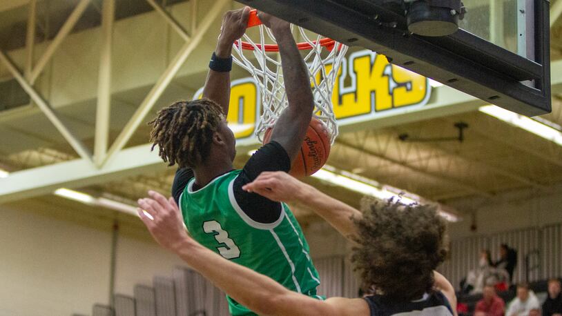 Northmont's Dalin Wilkins dunks early in the first half against Lebanon on Wednesday night at Centerville High School. Jeff Gilbert/CONTRIBUTED
