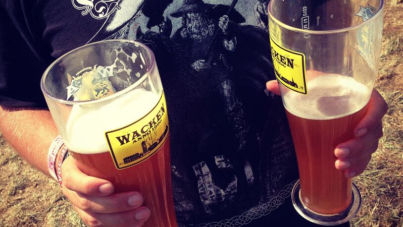 A festival-goer holds two glasses of beer at the 2014 Wacken Open Air heavy metal music festival on on August 1, 2014 in Wacken, Germany. Wacken is a village in northern Germany with a population of 1,800 that has hosted the annual four-day festival, which attracts 75,000 heavy metal fans from around the world, since 1990.  (Photo by Sean Gallup/Getty Images)