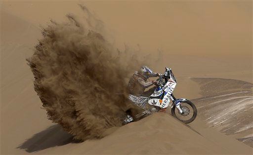 KTM rider Jorge Aguilar of Salvador tries to get out of a dune during the 6th stage of the 2013 Dakar Rally from Arica to Calama, Chile.