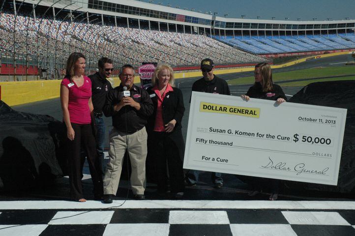 IMAGES: NASCAR drivers, breast cancer survivors paint pit road pink