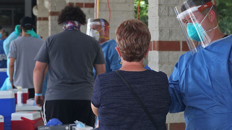Several hundred people showed up the be tested during the Clark County Combined Health Department's free COVID-19 clinic at Perrin Woods Elementary School on July 15. BILL LACKEY/STAFF