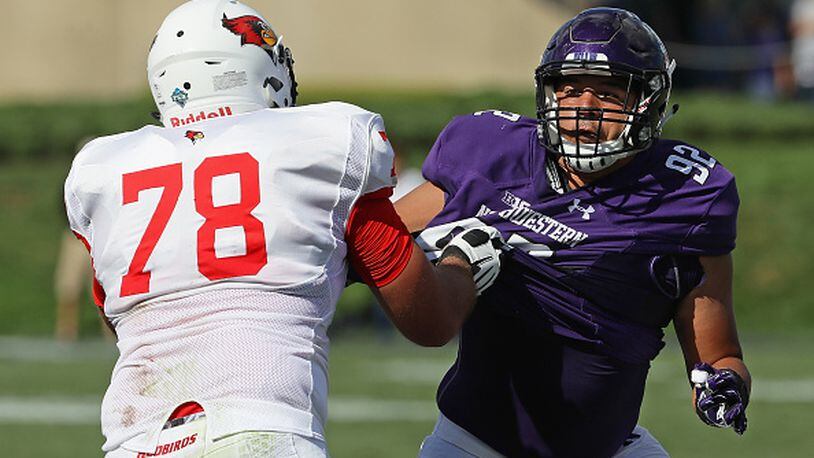 EVANSTON, IL - SEPTEMBER 10: Fred Wyatt #92 of the Northwestern Wildcats runshes against Cameron Lee #78 of the Illinois State Redbirds at Ryan Field on September 10, 2016 in Evanston, Illinois. (Photo by Jonathan Daniel/Getty Images)