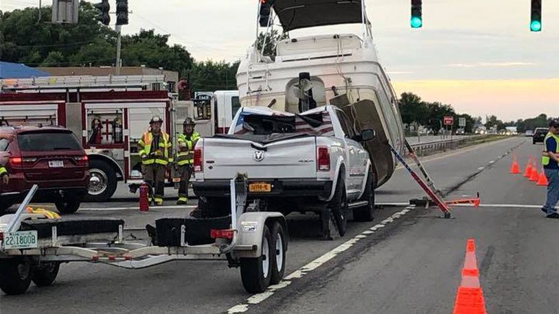 A boat broke free from its trailer and crashed on top of a truck. (Photo: Union Hill Fire Department)