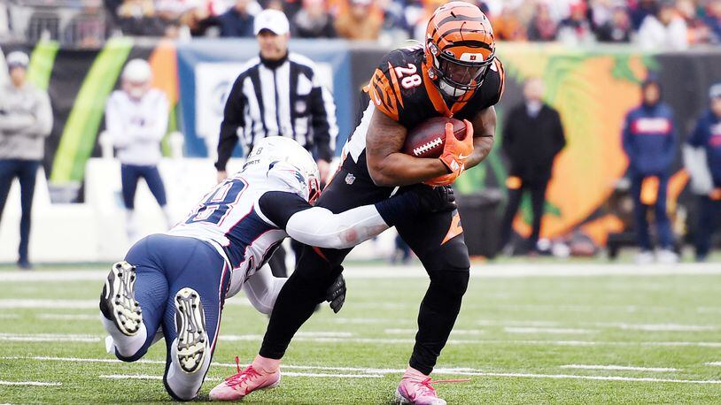 CINCINNATI, OHIO - DECEMBER 15: Joe Mixon #28 of the Cincinnati Bengals carries the ball during the first half against the New England Patriots in the game at Paul Brown Stadium on December 15, 2019 in Cincinnati, Ohio. (Photo by Bobby Ellis/Getty Images)