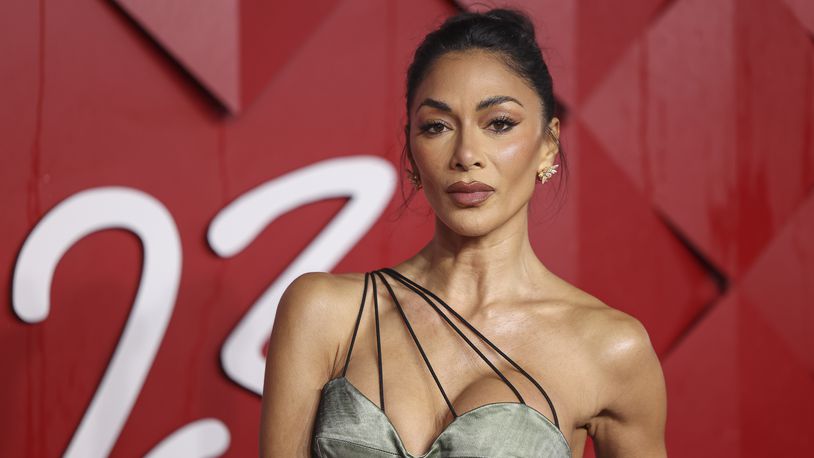 Nicole Scherzinger poses for photographers upon arrival at the British Fashion Awards on Monday, Dec. 4, 2023 in London. (Vianney Le Caer/Invision/AP)