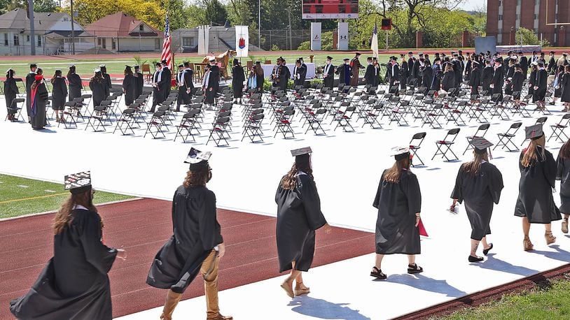 Wittenberg University and Clark State College will host their graduation ceremonies this weekend. Here, Wittenberg held their 171 Commencement Ceremony last year at the school's Edwards-Maurer Stadium instead of the traditional Commencement Hollow. BILL LACKEY/STAFF
