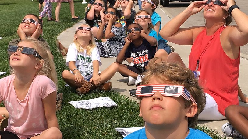 Students at Horace Mann Elementary gather outside Aug. 21, 2017, to watch the solar eclipse. Bill Lackey/Staff