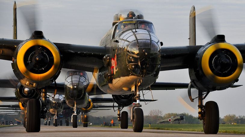 Twenty vintage B-25 bombers line up for take off at Grimes Field in Urbana on April 18, 2012 as they depart for Wright Patterson Air Force Base for the Doolittle Raiders Reunion. It was the largest gathering of the planes since WWII. Staff photo by Bill Lackey