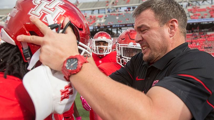 HOUSTON, TX - OCTOBER 29: Tom Herman Head Coach of the University of Houston reacts after head banging a player's helmet as he fires the team up on the field before their game against the University of Central Florida at TDECU Stadium on October 29, 2016 in Houston, Texas. (Photo by Richard Carson/Getty Images)