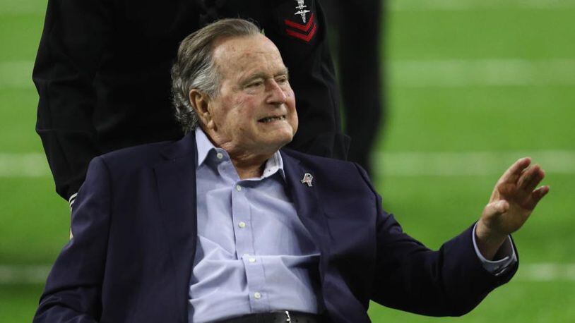 President George H.W. Bush arrives for the coin toss prior to Super Bowl 51 between the Atlanta Falcons and the New England Patriots at NRG Stadium on February 5, 2017 in Houston, Texas.  (Photo by Patrick Smith/Getty Images)