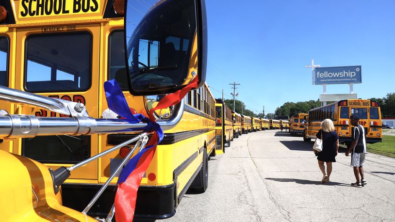 The Fellowship Christian Church was surrounded by 37 school buses Monday, August 28, 2023 during the funeral for 11-year-old Aiden Clark, who was killed in a Northwestern school bus crash. BILL LACKEY/STAFF