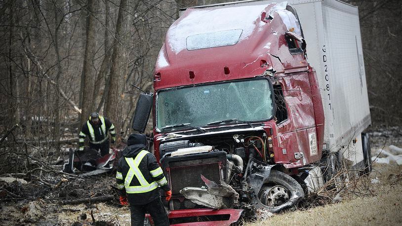 A tractor trailer slid off westbound 70 near the 66 mile marker in Clark County sliding into a tree line Thursday, February 3, 2022 causing heavy damage there were no injuries. MARSHALL GORBY/STAFF