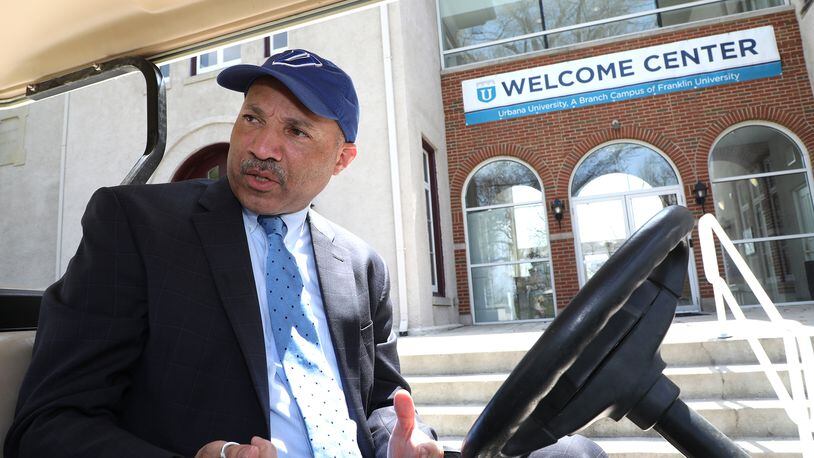 Dr. Christopher Washington, president of Urbana University, pauses outside the new Urbana Univsersity Welcome Center as he talks about the improvements that school has undergone in the past year. Bill Lackey/Staff