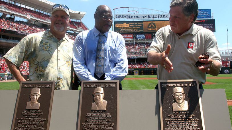 Former Cincinnati Reds players Tom Browning, Lee May and Tom Seaver, from left, stand next to their plaques during a ceremony inducting them into the Reds Hall of Fame before the baseball game against the Colorado Rockiesin Cincinnati Sunday, July 16, 2006.  (AP Photo/Tom Uhlman)