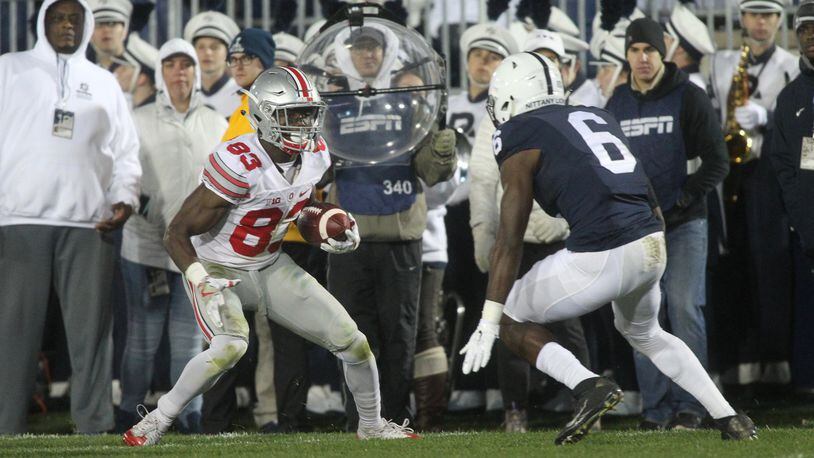 Ohio State’s Terry McLaurin looks for running room after a catch against Penn State on Saturday, Oct. 22, 2016, at Beaver Stadium in State College, Pa. David Jablonski/Staff
