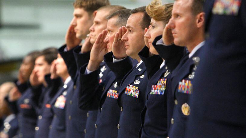 U.S. Air Force personnel who work at the National Air and Space Intelligence Center (NASIC) make their first salute to then-incoming NASIC Commander Col. D. Scott George during a change-of-command ceremony at the National Museum of the United States Air Force in this 2008 photo. Staff photo by Ty Greenlees