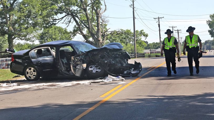 A two-vehicle accident in the 2700 block of Springfield-Jamestown Road in Springfield Twp. sent four people to the hospital, one by CareFlight in serious condition on Friday. BILL LACKEY/STAFF