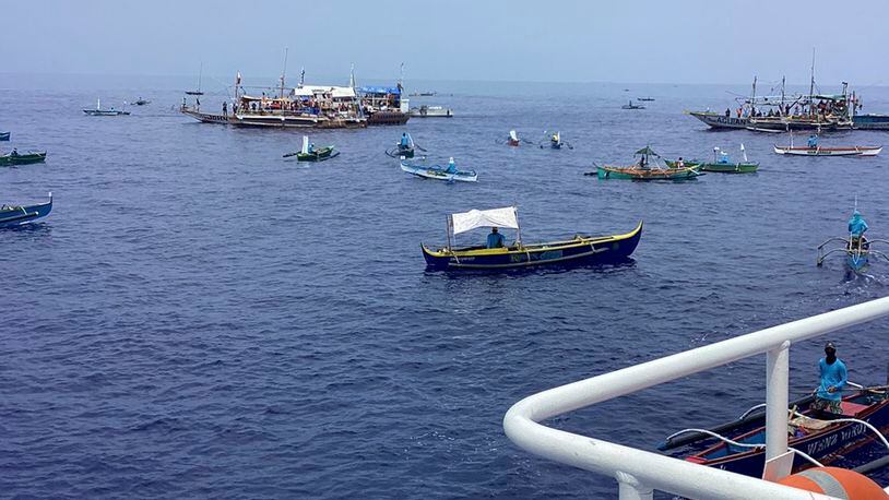 In this photo provided by the Philippine Coast Guard, fishing boats carrying activists and volunteers belonging to a nongovernment coalition called Atin Ito, Tagalog for This is Ours, pass by waters off Palauig Point, Zambales province, northwestern Philippines as they head towards Scarborough Shoal on Wednesday May 15, 2024. A flotilla of about 100 mostly small fishing boats led by Filipino activists sailed Wednesday to a disputed shoal in the South China Sea, where Beijing's coast guard and suspected militia ships have used powerful water cannons to ward off what they regard as intruders. (Philippine Coast Guard via AP)