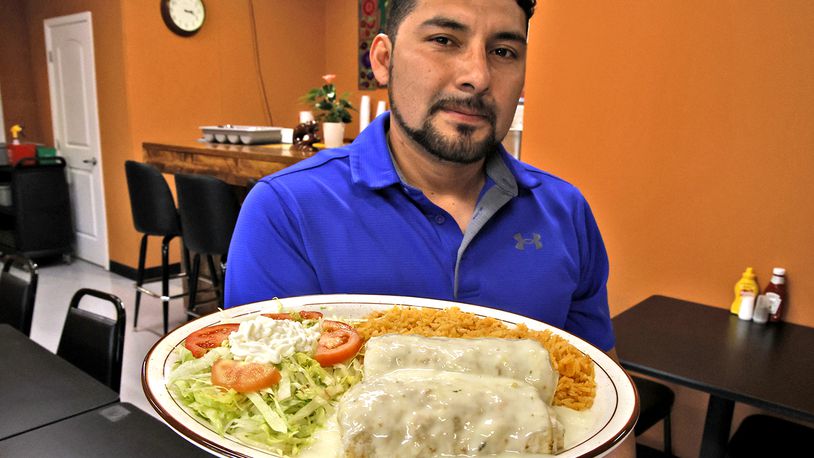 Edwin Gonzalez Cruz is serving up delicious food at his new restaurant called Los Chiapanecos Mexican Restaurant. The new restaurant, at the intersection of South Yellow Springs Street and Fair Street officially opened on Monday. BILL LACKEY/STAFF