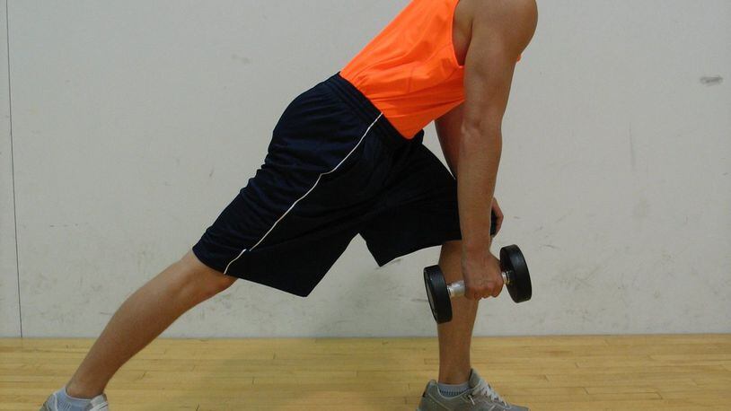 Hold dumbbell in right hand, other hand on left knee. CONTRIBUTED