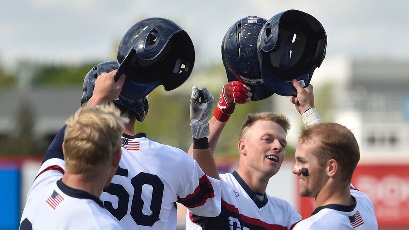 Dayton celebrates a home run by Connor Echols, second from right, against Saint Joseph’s on April 26, 2019, in Dayton. Photo by Erik Schelkun