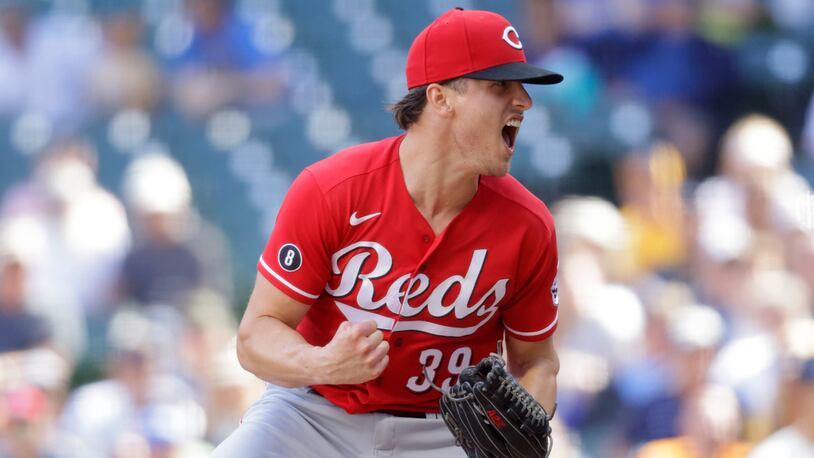 Cincinnati Reds pitcher Lucas Sims reacts after striking out Milwaukee Brewers Jackie Bradley Jr., to end the baseball game against the Milwaukee Brewers Wednesday, June 16, 2021, in Milwaukee. (AP Photo/Jeffrey Phelps)