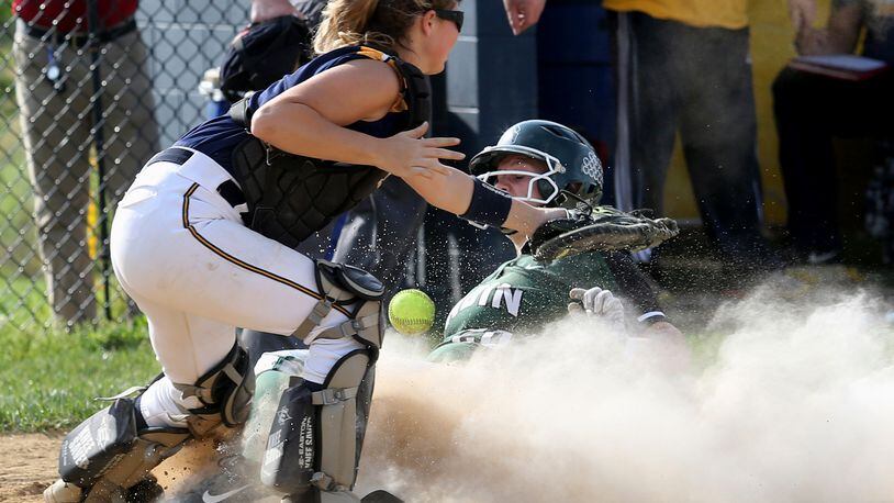 Contributed photo by E.L. Hubbard Badin base runner Samantha Sander scores a run as Monroe catcher Sarah Eschmeyer can’t hand on to the throw during their game at Monroe Wednesday, Apr. 19, 2017.