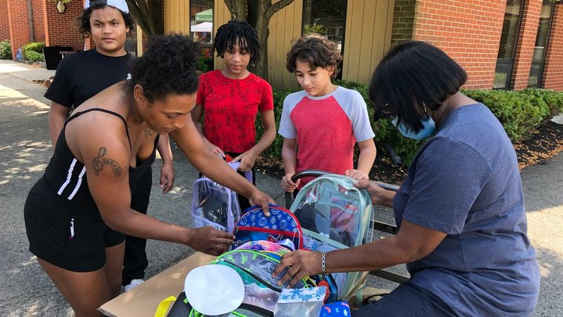 Free back to school items including backpacks, water bottles and hygiene items were a big part of events at Springfield’s Church of Jesus Family Worship Center on Saturday afternoon. More than 350 backpacks and 50 water bottles were given away. Brett Turner/CONTRIBUTED