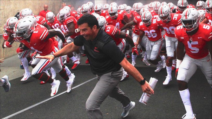 Ryan Day leads Ohio State onto the field before a game against Oregon State on Saturday, Sept. 1, 2018, in Columbus. David Jablonski/Staff