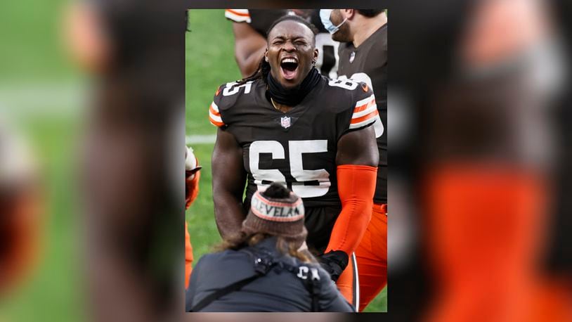 Cleveland Browns defensive tackle Larry Ogunjobi celebrates after the team defeated the Pittsburgh Steelers in an NFL football game, Sunday, Jan. 3, 2021, in Cleveland. (AP Photo/Ron Schwane)