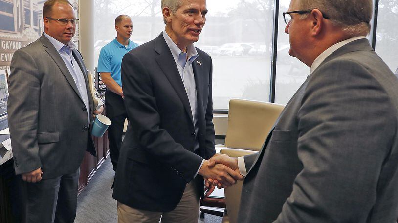 U.S. Sen. Rob Portman, center, meets with the Chamber of Greater Springfield on Monday to discuss the issue of tax reform. Bill Lackey/Staff