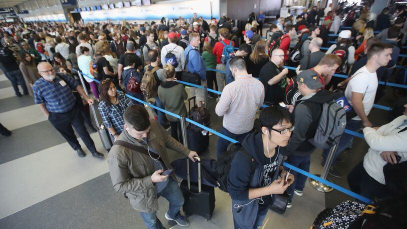 CHICAGO, IL - MAY 16: Passengers at O'Hare International Airport wait in line to be screened at a Transportation Security Administration (TSA) checkpoint on May 16, 2016 in Chicago, Illinois. (Photo by Scott Olson/Getty Images)