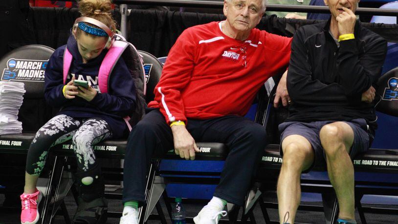 John Miller, center, father of Dayton coach Archie Miller, watches the Flyers practice Thursday. Archie’s daughter Leah is at left. David Jablonski/Staff