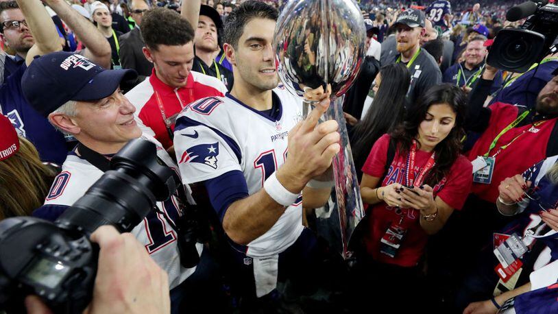 HOUSTON, TX - FEBRUARY 05:  Jimmy Garoppolo #10 of the New England Patriots holds the Vince Lombardi Trophy after defeating the Atlanta Falcons 34-28 in overtime during Super Bowl 51 at NRG Stadium on February 5, 2017 in Houston, Texas.  (Photo by Tom Pennington/Getty Images)
