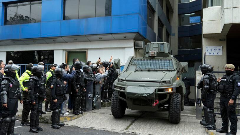 A military vehicle transports former Ecuadorian Vice President Jorge Glas from the detention center where he was held after police broke into the Mexican Embassy to arrest him in Quito, Ecuador, Saturday, April 6, 2024. Glas, who held the vice presidency of Ecuador between 2013 and 2018, was convicted of corruption and had been taking refuge in the embassy since December. (AP Photo/Dolores Ochoa).
