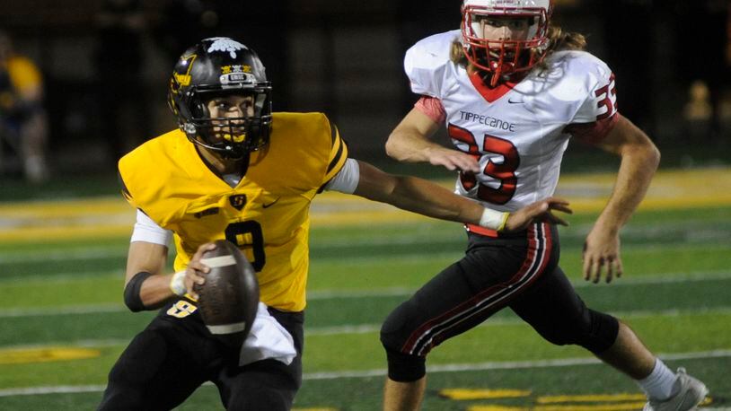 Sidney QB Andre Gordon and Tipp’s Mason Doll. Sidney defeated visiting Tippecanoe 49-42 in a Week 7 GWOC American North high school football game on Thursday, Oct. 5, 2017. MARC PENDLETON / STAFF