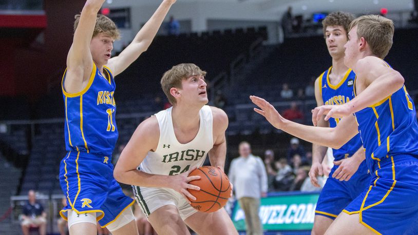 Catholic Central's Tyler Galluch looks for an opening against Russia during Tuesday night's Division IV district final at UD Arena. Galluch scored 20 points, but Russia won 70-58. CONTRIBUTED/Jeff Gilbert