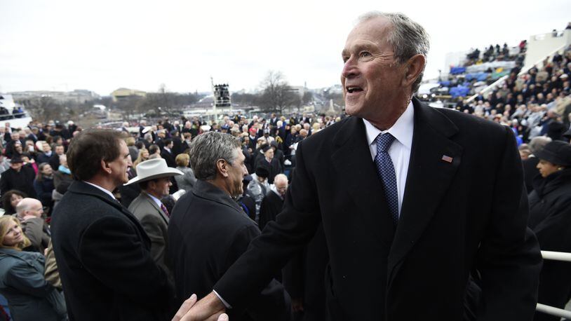 Former US President George W. Bush leaves after the Presidential Inauguration at the US Capitol on January 20, 2017 in Washington, DC. (Photo by Saul Loeb - Pool/Getty Images)