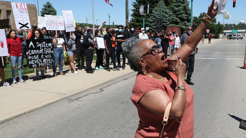 Denise Williams, president of the Springfield NAACP, leads the protesters in a chant during a demonstration last summer against racial injustice in the country. BILL LACKEY/STAFF