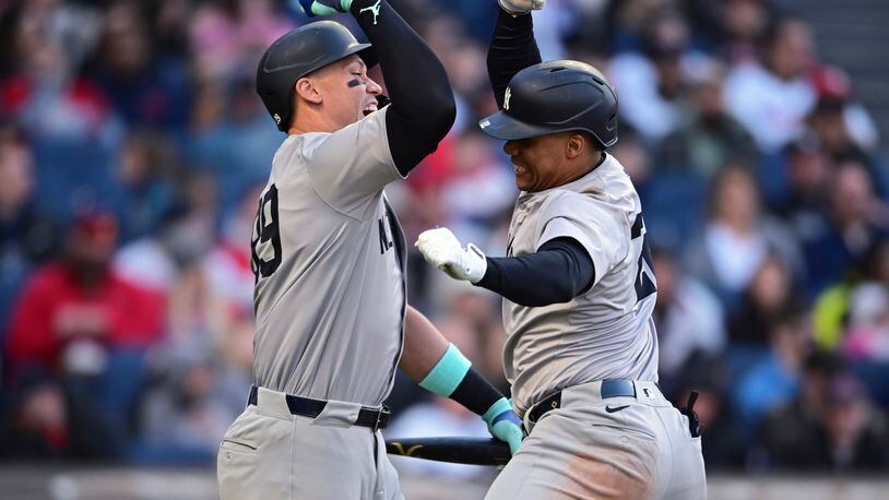 New York Yankees' Juan Soto, right, is congratulated by Aaron Judge after Soto's three-run home run off Cleveland Guardians starting pitcher Triston McKenzie during the fourth inning in the second baseball game of a doubleheader Saturday, April 13, 2024, in Cleveland. (AP Photo/David Dermer)