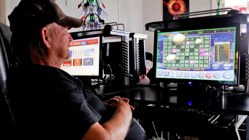 Larry Truman plays a game on an internet terminal at Erie Sweepstakes Thursday, Aug. 9, 2012 on South Erie Boulevard in Hamilton.